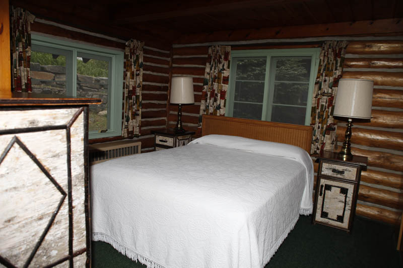 Log Cabins bedroom with full bed
